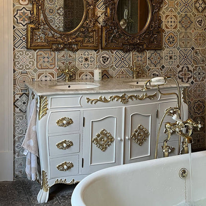 Ornate white vanity unit with gold carvings