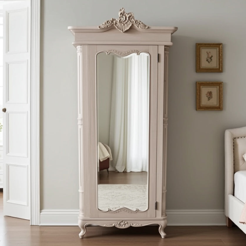 Beige armoire with a large mirror in a bedroom setting