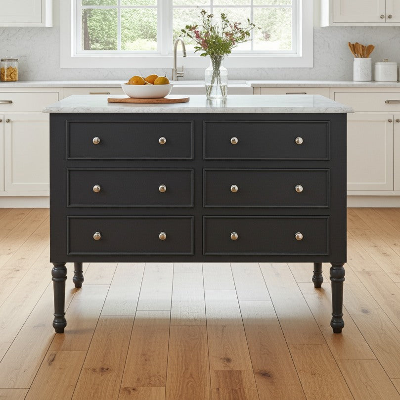 Dark gray kitchen island with marble countertop in a bright kitchen