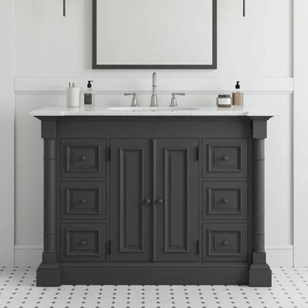 Dark gray bathroom vanity with white countertop and sink in a bathroom setting.