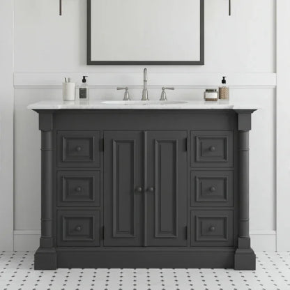 Dark gray bathroom vanity with white countertop and sink in a bathroom setting.