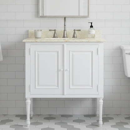 White bathroom vanity with marble countertop and sink against a tiled wall.