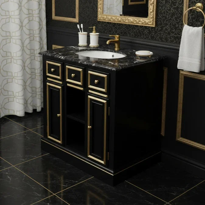 Bathroom vanity with black marble countertop, gold fixtures, and decorative elements.
