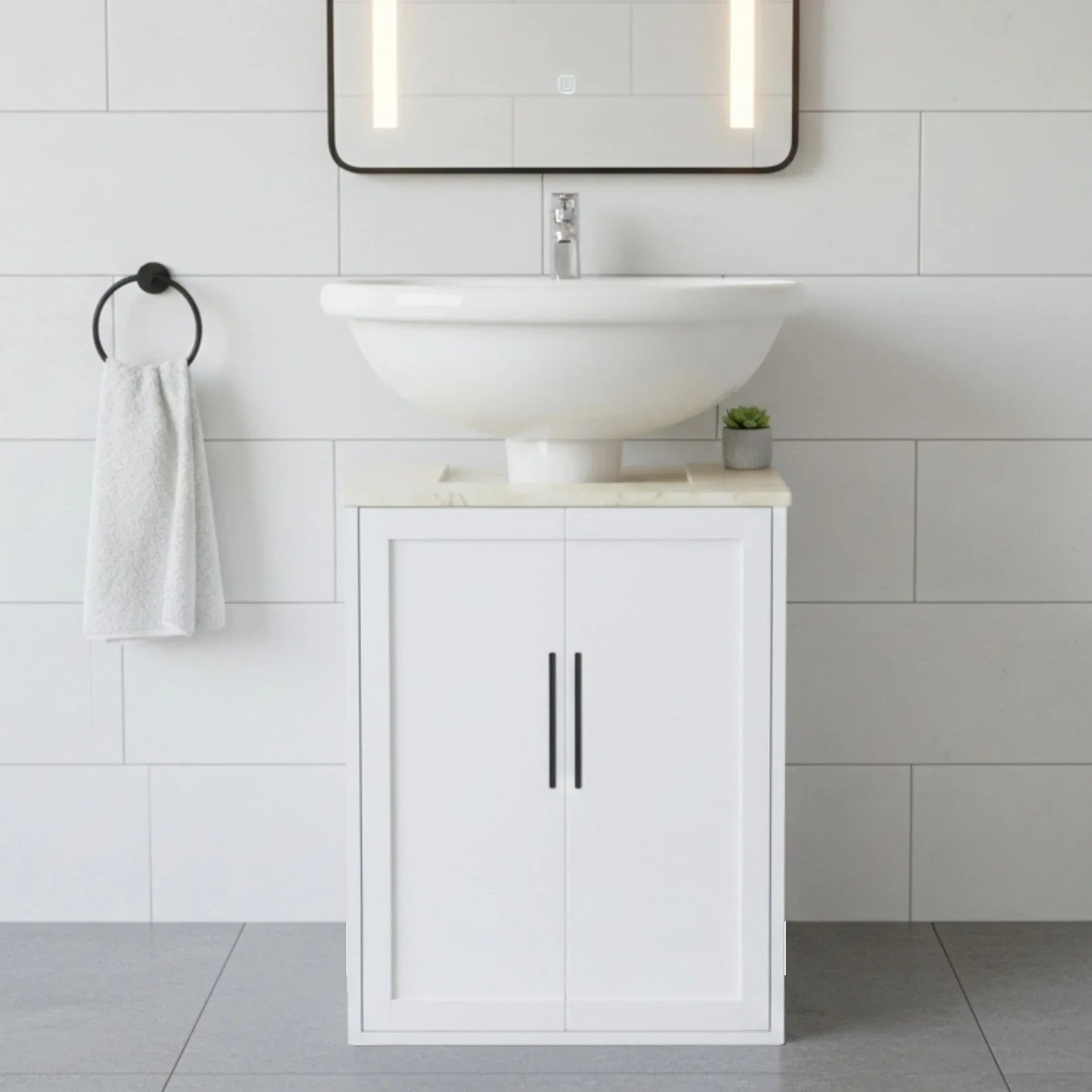 Bathroom vanity with white sink and cabinet against a tiled wall.
