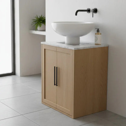 Bathroom vanity with wooden cabinet, white sink, and black faucet.