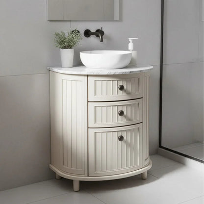 Bathroom vanity with white sink and marble countertop in a modern bathroom setting.