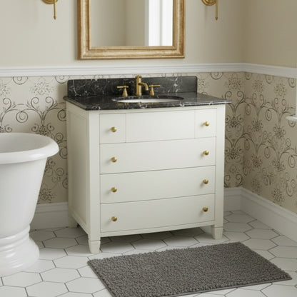 Bathroom with white vanity, black marble countertop, and freestanding bathtub.