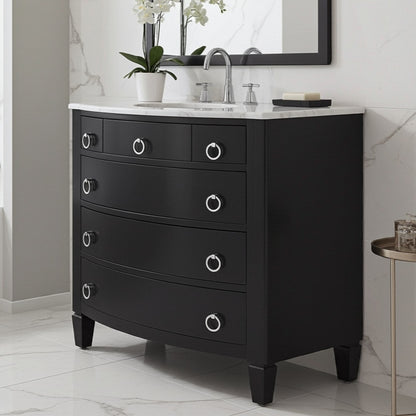 Black bathroom vanity with marble countertop and decorative items in a bathroom setting.