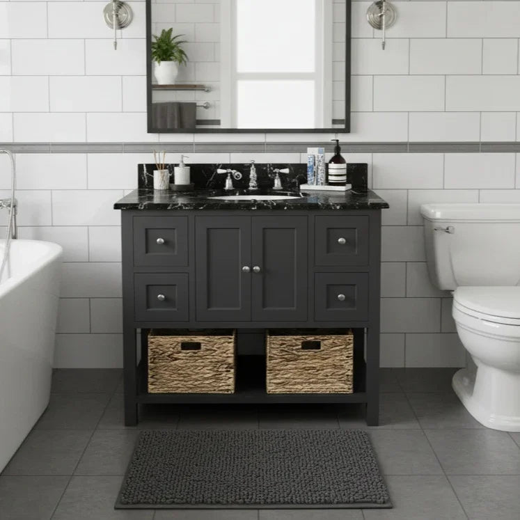 Bathroom with dark gray vanity, white tiles, and a toilet.