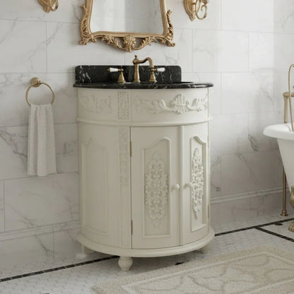 Decorative bathroom vanity with marble countertop and ornate mirror in a marble-walled bathroom.