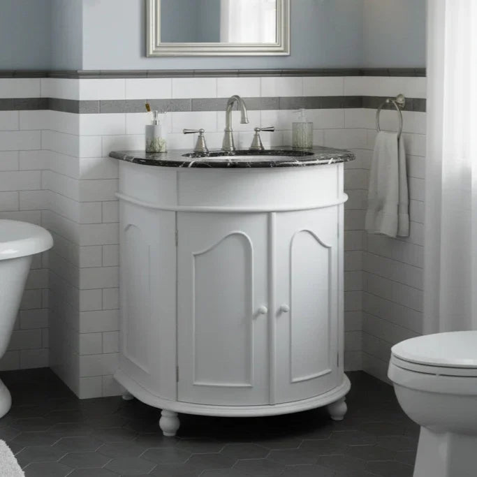 Bathroom with a white vanity unit, sink, and mirror.