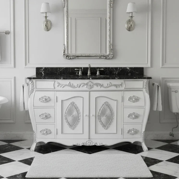 Vintage-style bathroom vanity with marble countertop and ornate design in a classic bathroom setting.