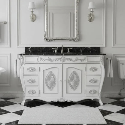 Vintage-style bathroom vanity with marble countertop and ornate design in a classic bathroom setting.
