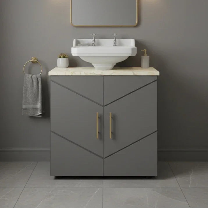 Bathroom vanity with sink and cabinet against a gray wall.