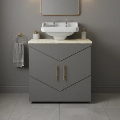 Bathroom vanity with sink and cabinet against a gray wall.