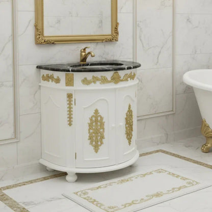 Decorative bathroom vanity with gold accents in a marble bathroom setting.