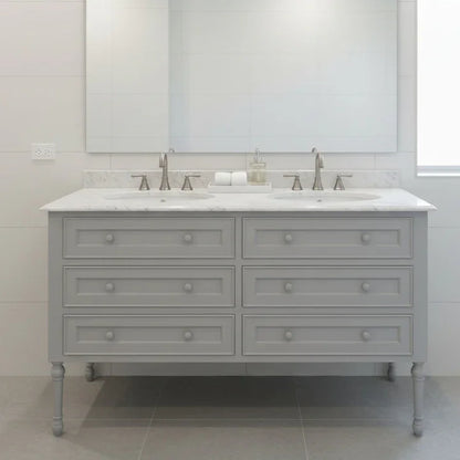 Gray bathroom vanity with white countertop and marble-like finish in a modern bathroom setting.