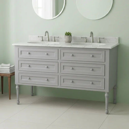 Gray bathroom vanity with marble countertop, undermount sinks, and round mirrors in a green bathroom.