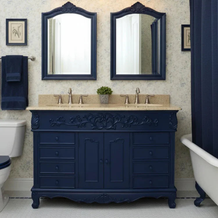 Bathroom with navy blue vanity, mirrors, and bathtub.