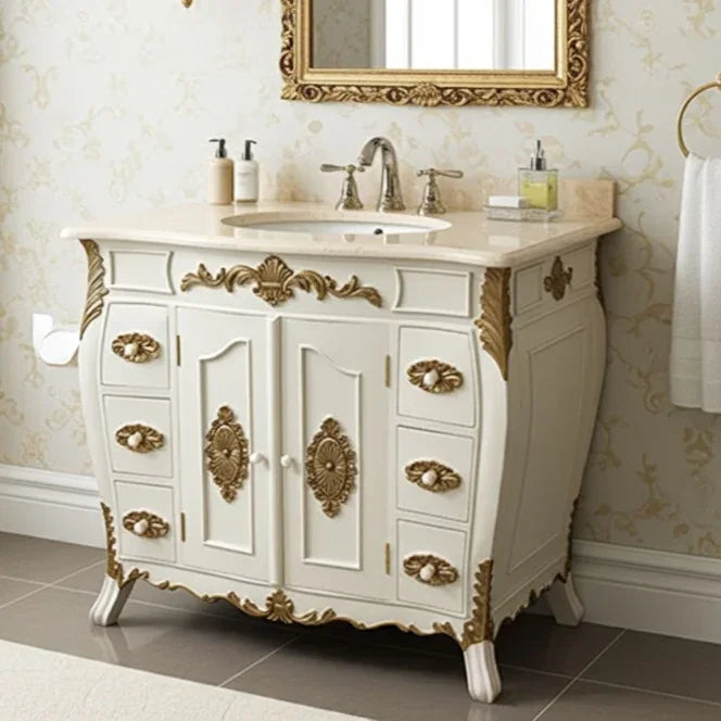 Decorative bathroom vanity with marble countertop, sink, and ornate gold details.