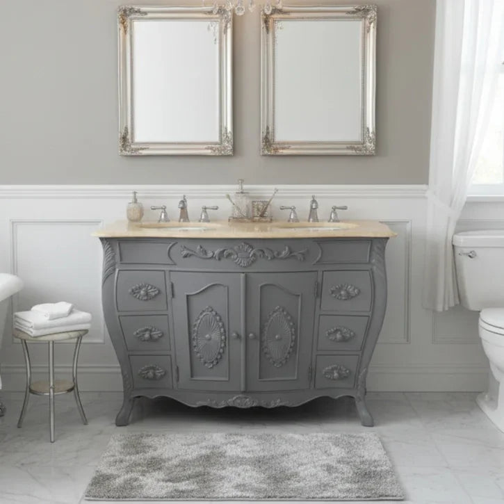 Bathroom with a gray vanity, two mirrors, and a toilet.