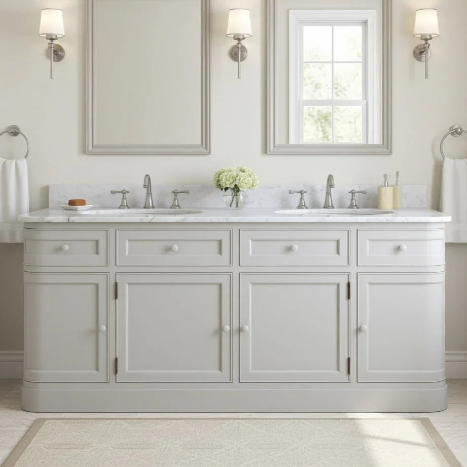 Bathroom vanity with two sinks, mirrors, and decorative elements.