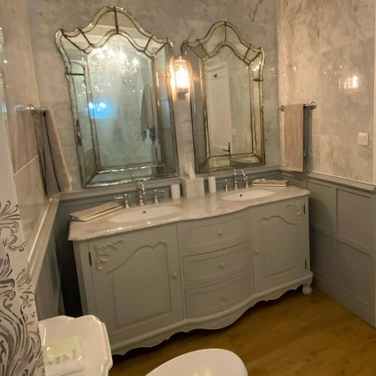 swiss double vanity with marble countertop in a bathroom setting