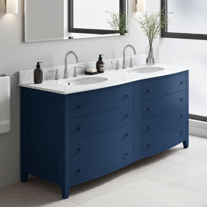 Bathroom vanity with blue cabinets, white countertop, and sink.