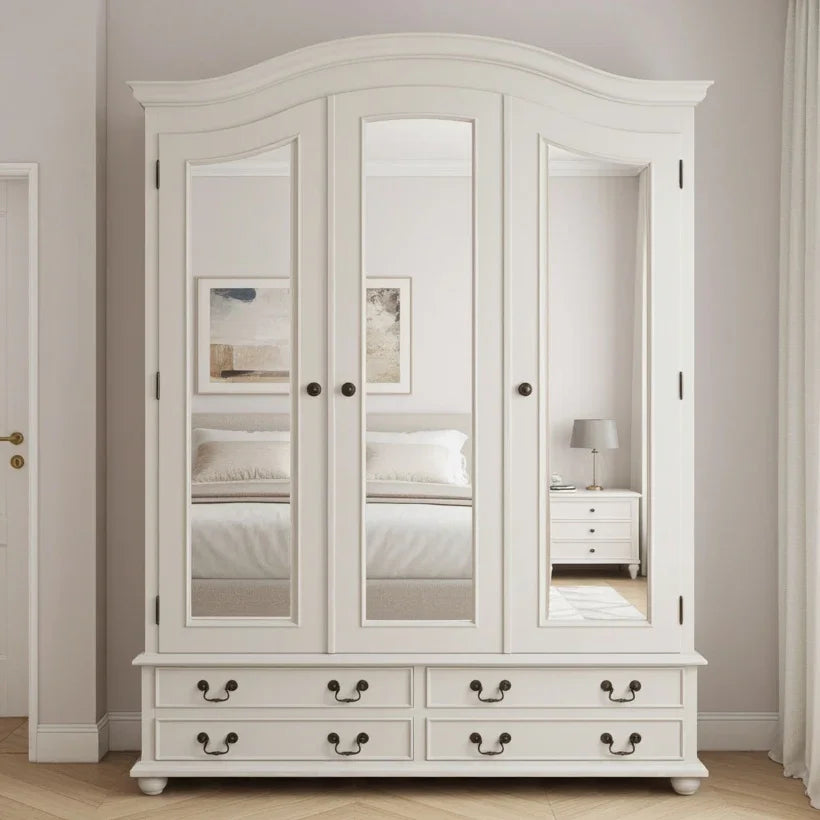 White wardrobe with mirror panels in a room setting