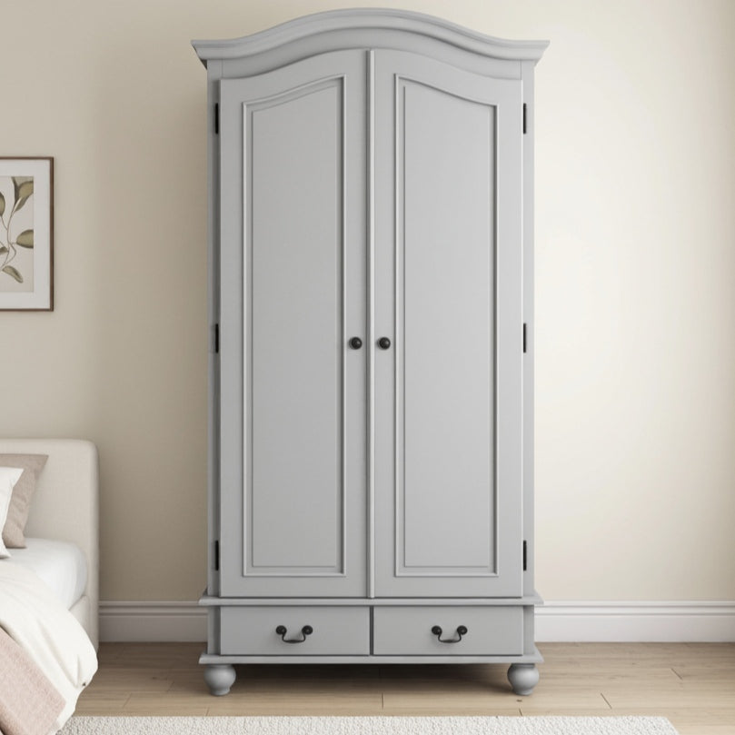 Gray wardrobe with two doors and a drawer in a bedroom setting.