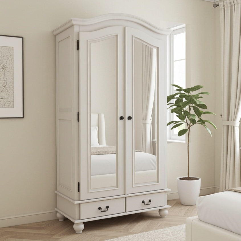 White wardrobe with mirrored doors in a bedroom setting