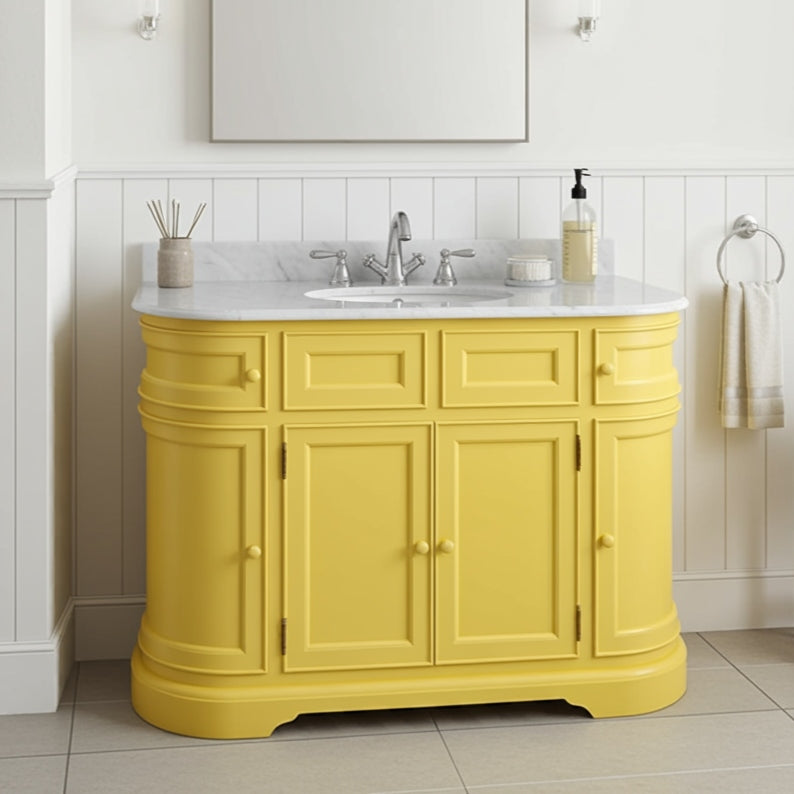 Yellow bathroom vanity with white countertop and sink in a bathroom setting.