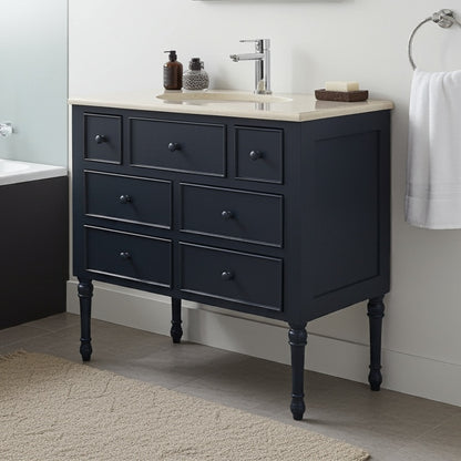 Black bathroom vanity with sink and toiletries in a modern bathroom setting.