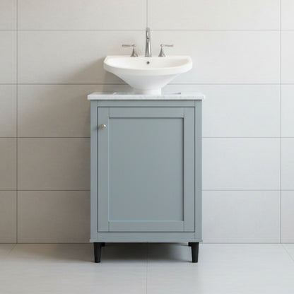 Gray vanity with white sink against a tiled wall