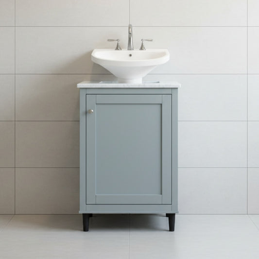 Gray vanity with white sink against a tiled wall