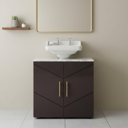 Bathroom vanity with white sink and dark brown cabinet against a beige wall.