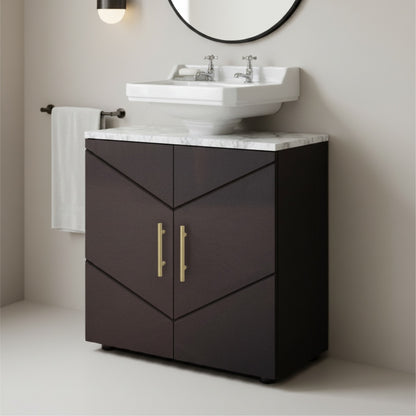Bathroom vanity with white sink and marble countertop against a beige wall.
