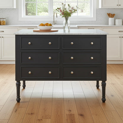 Dark gray kitchen island with marble countertop in a bright kitchen