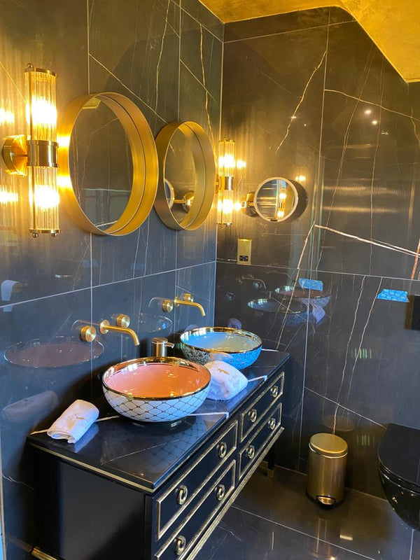 bespoke black and gold vanity unit with above counter basins
