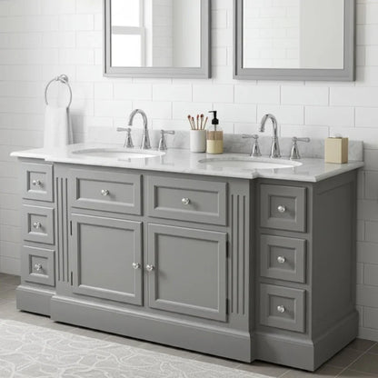 Gray bathroom vanity with two sinks and mirrors in a tiled bathroom.