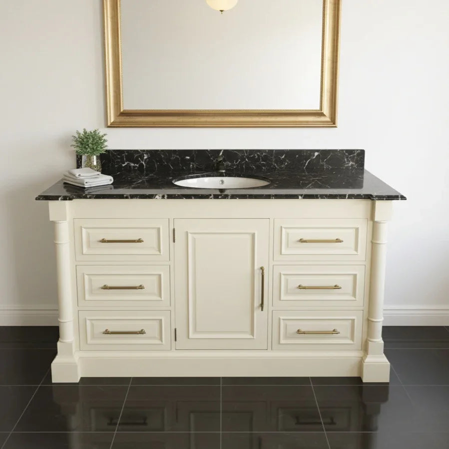 Bathroom vanity with black marble top and gold fixtures