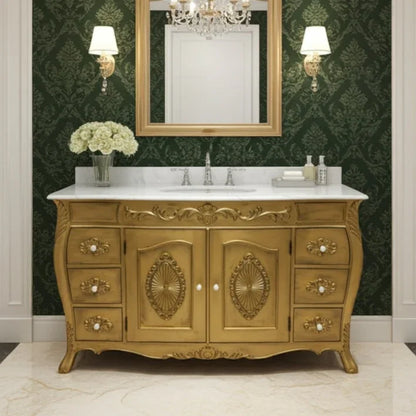 Decorative gold bathroom vanity with marble countertop, mirror, and wall lights against a green patterned wallpaper.