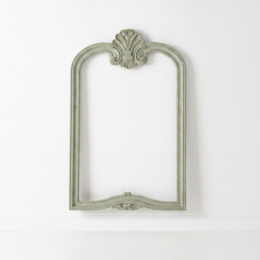 mahogany mirror frame on white wall
