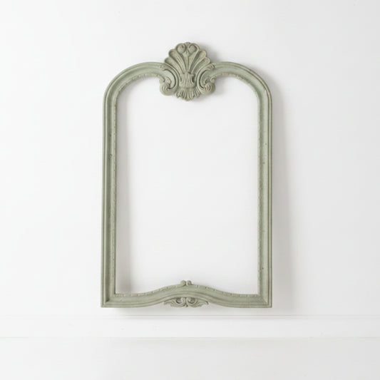 mahogany mirror frame on white wall
