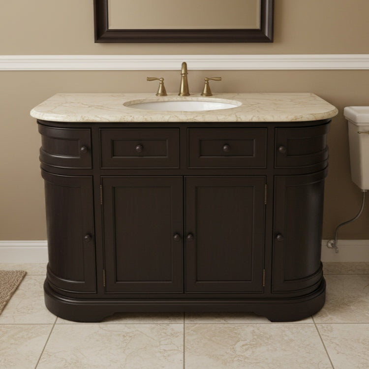 Bathroom vanity with cream marble countertop and faucet against a beige wall.
