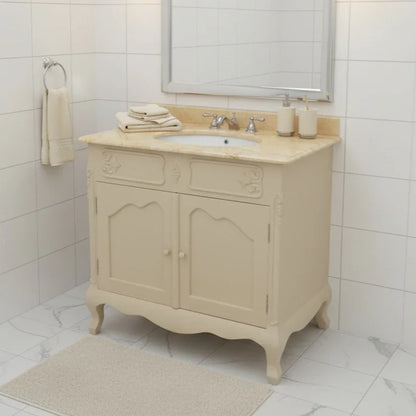 Beige bathroom vanity with marble countertop and sink in a tiled bathroom.