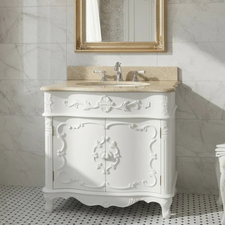 Decorative white bathroom vanity with marble countertop and mirror in a marble-tiled room.