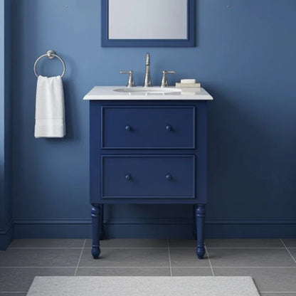 Bathroom vanity with sink against a blue wall
