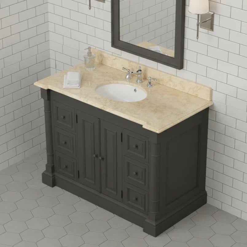 Bathroom vanity with beige countertop and mirror against a tiled wall.