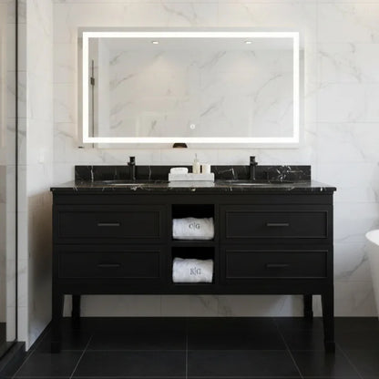 Bathroom vanity with black marble countertop and illuminated mirror.